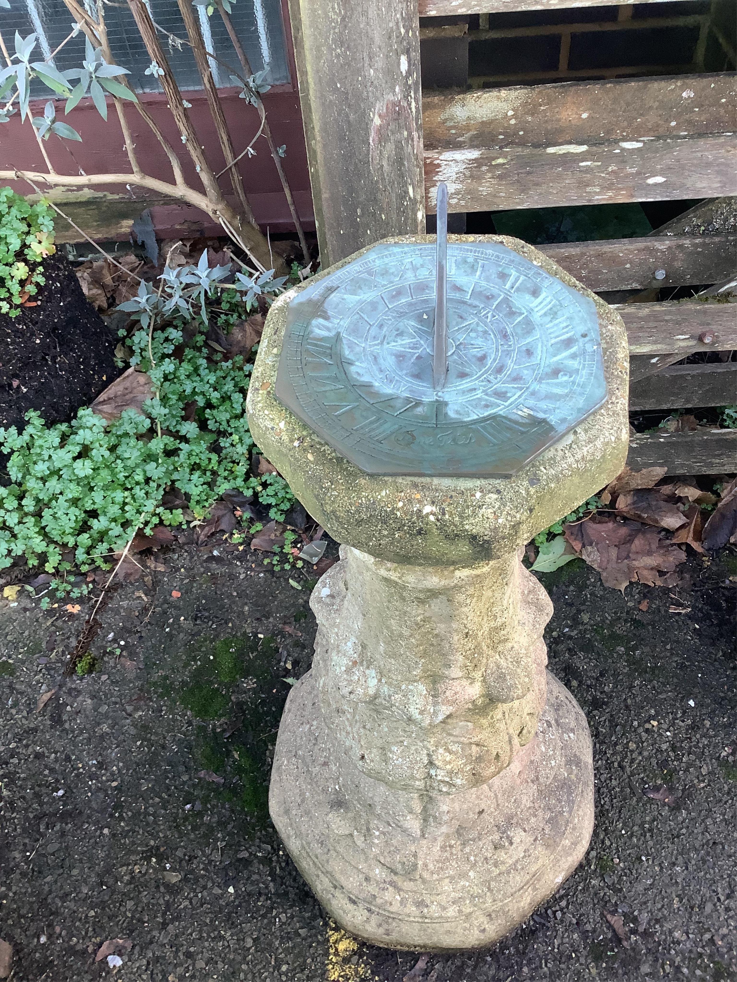 A reconstituted stone sundial, with bronze dial and gnomon, height 86cm. Condition - fair